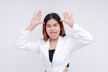 A crazy young woman making a teasing face with her tongue sticking out. Isolated on a white background.