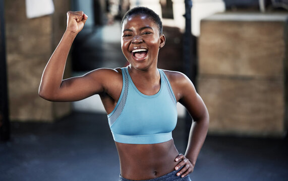 Portrait, fitness or happy black woman flexing with strong biceps muscle or  body goals in training workout. Exercise, powerful arms or healthy African  girl sports athlete excited by results at gym Stock