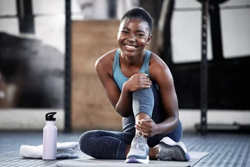 Gartenposter Relax, portrait or happy black woman at gym for a workout, exercise or training for healthy body or fitness. Face of sports girl or African athlete smiling or relaxing on break with positive mindset © Michael Cunningham/peopleimages.com