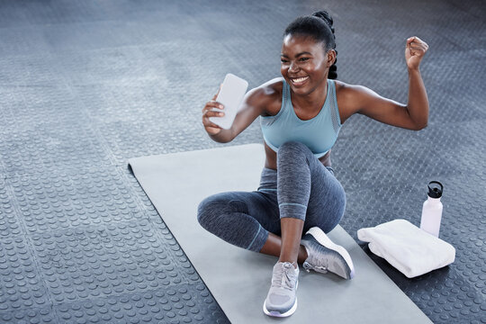Gym, flexing or happy black woman taking selfie on workout, exercise or training break on social media. Wellness, smile or healthy African girl relaxing or taking pictures for online fitness content
