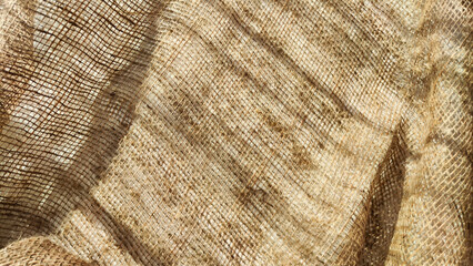 Fototapeta premium Natural fabric texture, frame and background of burlap. Rough crumpled burlap background. Selective and partial focus