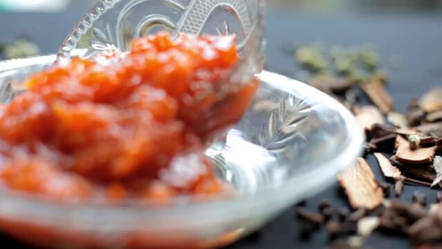 Murabba or Murba along with entire constituents of it on the surface.Made of Mango.Cinematic dolly shot.