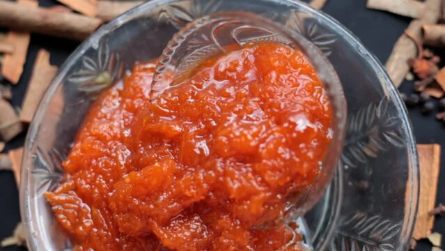 Murabba or Murba along with entire constituents of it on the surface.Made of Mango.Cinematic dolly shot.