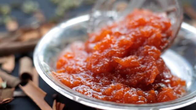 Murabba or Murba along with entire constituents of it on the surface.Made of Mango.Cinematic dolly shot.