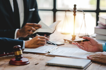 concept of justice and law Judge in courtroom on wooden table and consultant or lawyer working in...