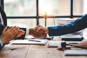 concept of justice and law Judge in courtroom on wooden table and consultant or lawyer working in office. Law advice and justice concept.