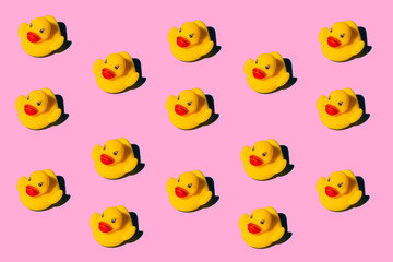 Yellow duck toy on a colored background