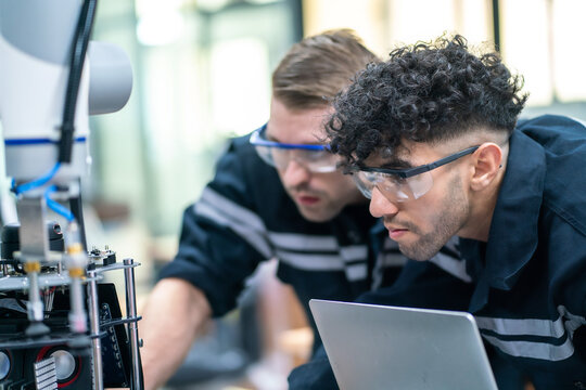 Mechanical Engineering Team Working In Robotic Technology Lap For Research And Develop For Manufacturing Automation And Robotics.