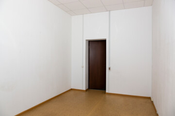 Fototapeta premium Interior of an empty room with a closed door