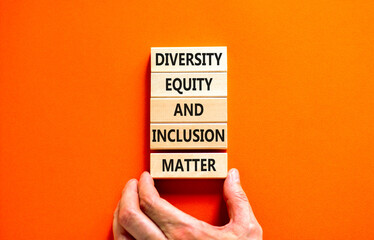 DEI Diversity equity inclusion matter symbol. Concept words DEI diversity equity and inclusion matter on wooden block. Beautiful orange background. Business diversity equity inclusion matter concept.