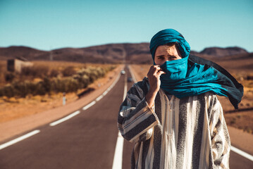 Portrait of a young white man dress as berber