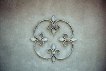 An element of wrought iron decor for the exterior decoration of buildings. Grey background of...