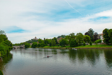 Italy, Piedmont, Turin, people go canoeing on the river Po in the Valentino park in front of the Castle of the Valentino