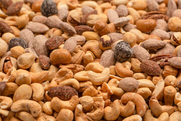 A group of almonds, pistachios, walnuts, macadamia, cashews.