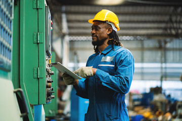 African American worker in  factory. Maintenance and repairing work in modern industry concept.
