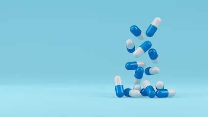 A group of antibiotic pill capsules on a light blue background. Healthcare and medical concept. 3D rendering.