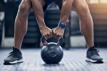 Exercise, floor and kettlebell with a bodybuilder man in the gym for a weightlifting workout...