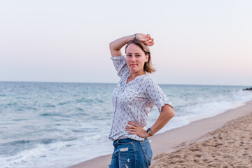 Portrait of a girl walking along the beach of the sea coast