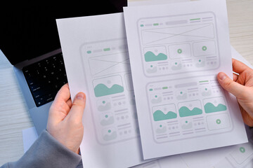 Man designer create website design wireframe. Sketch, prototype, framework, layout future design project. UI and UX - user interface, user experience designer. Creative concept for web design studio
