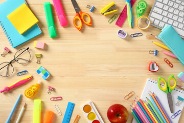 Various colorful school supplies on wooden table. Back to school concept. Flat lay, top view. - obrazy, fototapety, plakaty