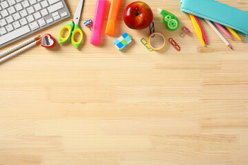 Frame border of school supplies on wooden table. Education, Back to school concept.