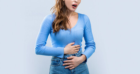 Woman touching his stomach. Stomach pain and others stomach disease concept. Girl having a...