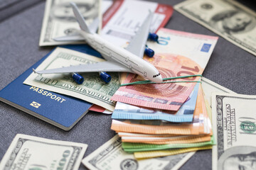 Plane on dollar cash background, travel with airplane concept.