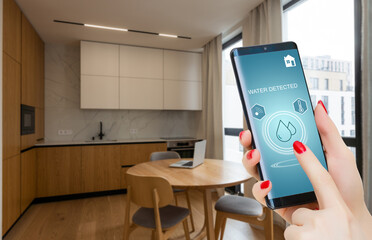 smart phone with home control application with water detected