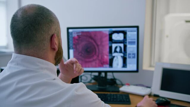 the patient undergoes computer tomography in the clinic, the radiologist monitors the progress of the procedure and the results of the stomach scan