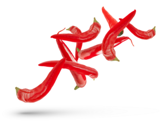 Pods of red hot peppers of various sizes and shapes fall on a white isolated background, casting a shadow. Fresh red pepper for insert in design or project, isolated on white, close up.