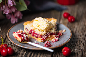 Tart with sour cherry creme, creme patisserie and crumbs, served with vanilla ice cream. Rustic and moody atmosphere and decoration.  - obrazy, fototapety, plakaty