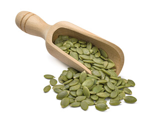 Wooden scoop with green pumpkin seeds isolated on white background