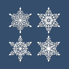 Set of laser cutting openwork snowflakes. Vector silhouette of christmas decoration. Template for paper isolated on blue background. Stencil for scrapbooking, carved wood.