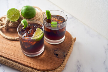 Cuba Libre with brown rum, cola and lime. Cuba Libre or long island cocktail. Focus Selective