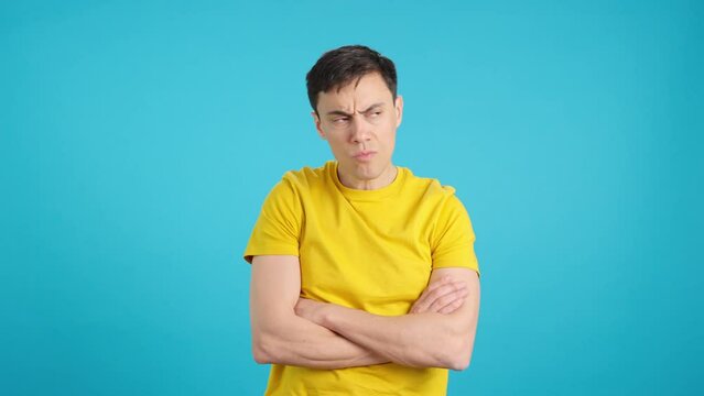 Angry man with his arms crossed shaking his head