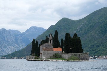 Fototapeta premium Saint George Island (Sveti Đorđe) - island historic Benedictine monastery of St. George and the old cemetery in the Adriatic Sea near town of Perast, Montenegro.