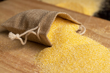 Dry corn flour poured into a linen bag for making porridge