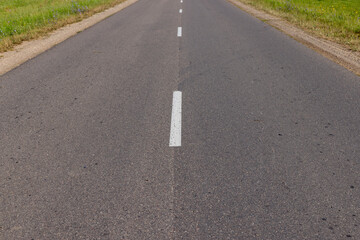 Obraz premium Narrow paved road for cars