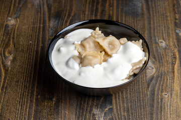 Sour cream covered dumplings with meat