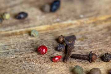 Different types of spices scattered on the table during cooking