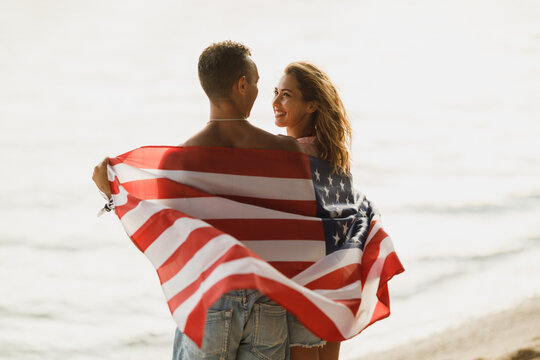 Couple With American National Flag - Powered by Adobe