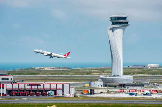 Istanbul, Turkey - June 3, 2023: Turkish Airlines airplane with Air Traffic Control Tower of Istanbul Airport. View of international Istanbul New Airport.  .