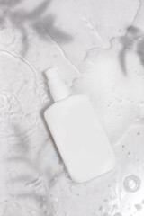 White Skincare Lotion Bottle with Water and Leaf Shadows