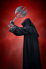 Dark knight with double headed battle axe over dark red misty background