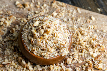 Crushed dried walnuts on the table