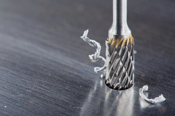 Milling cutter make sink in hole in steel billet. Locksmith work.