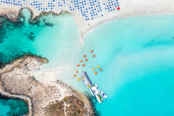 Cyprus -Nissi Beach in Ayia Napa, clean aerial photo of famous tourist beach in Cyprus, the place is a known destination on island and is formed from a smaller island just near the main shore