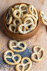 Poppy seed coating dried bagels on the table