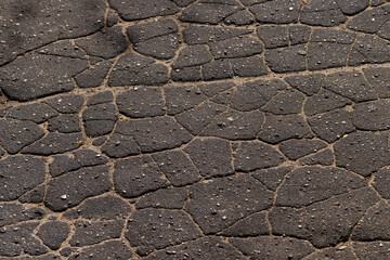 Damaged asphalt pavement , close up