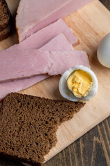 Boiled chicken egg with sliced pieces of meat